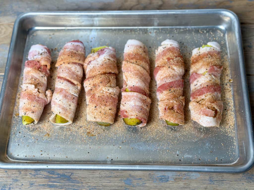 Pickles wrapped in bacon with bbq seasoning