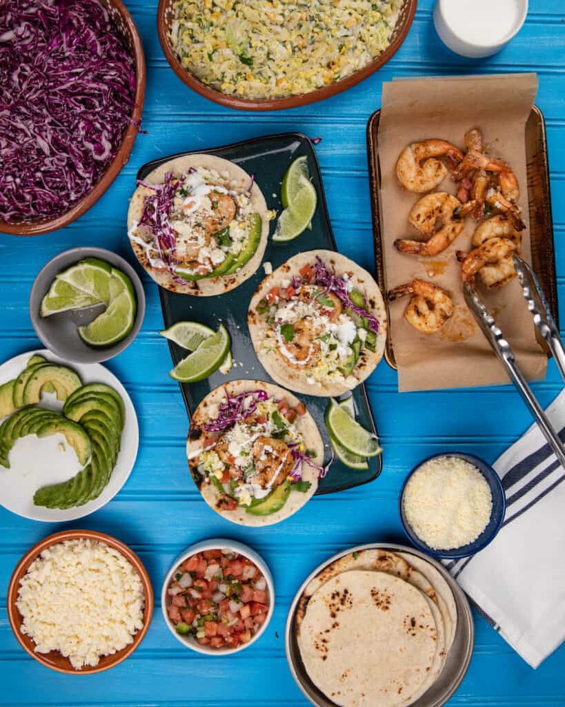 Grilled baja shrimp tacos with toppings 