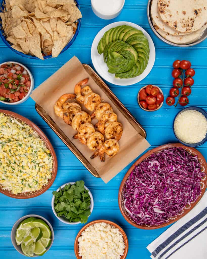 Grilled shrimp and toppings for tacos