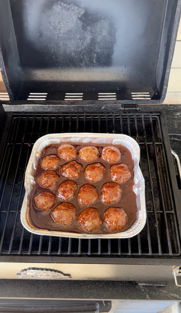 Meatballs cooking in bbq sauce