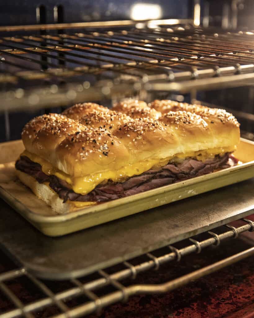 Roast beef and cheddar sliders in the oven