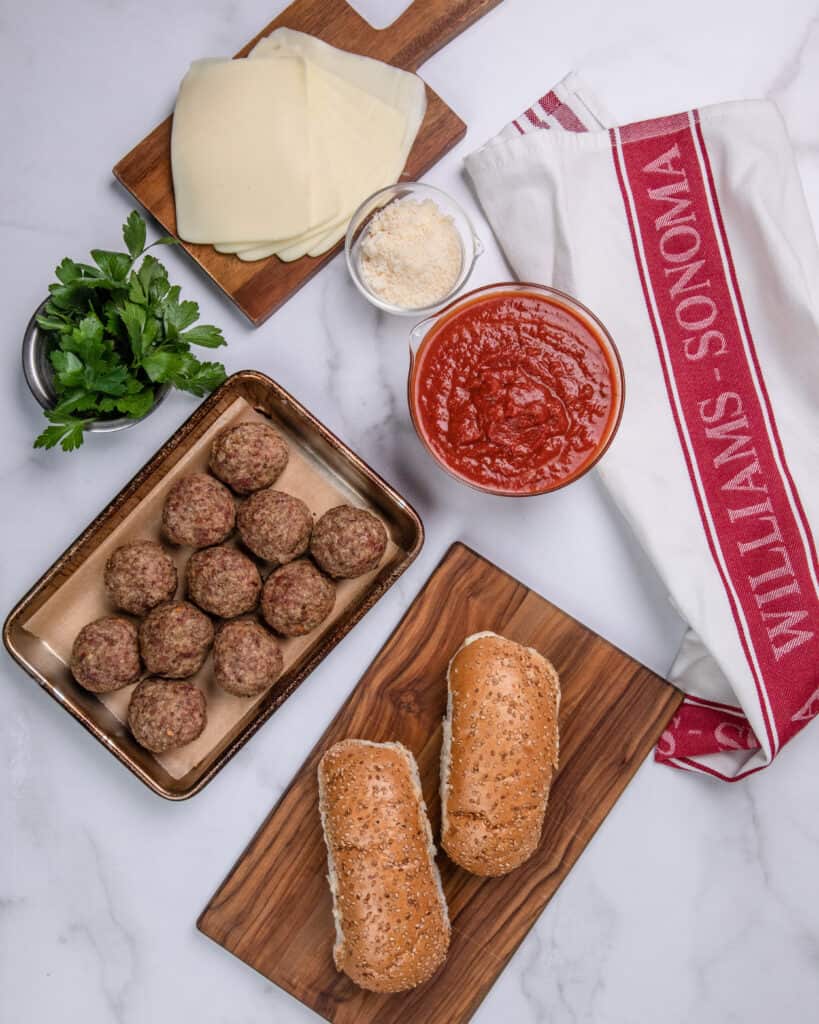 Ingredients laid out that go into a meatball sub