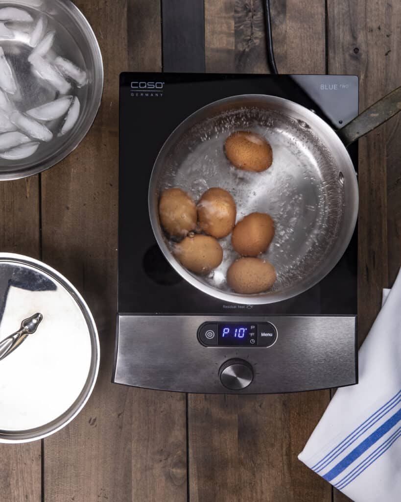 Eggs boiling in water