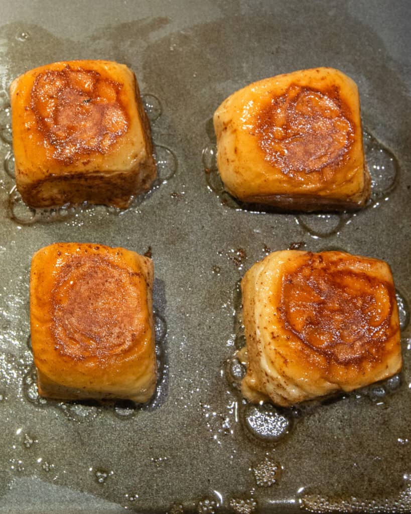 Hawaiian Rolls being seared in a pan