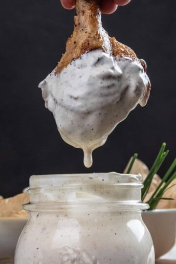Chicken drum stick dipped in Alabama white sauce