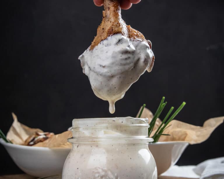 Chicken drum stick dipped in Alabama white sauce