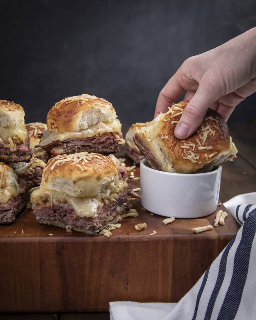 French dip sliders dipped in Au Jus.