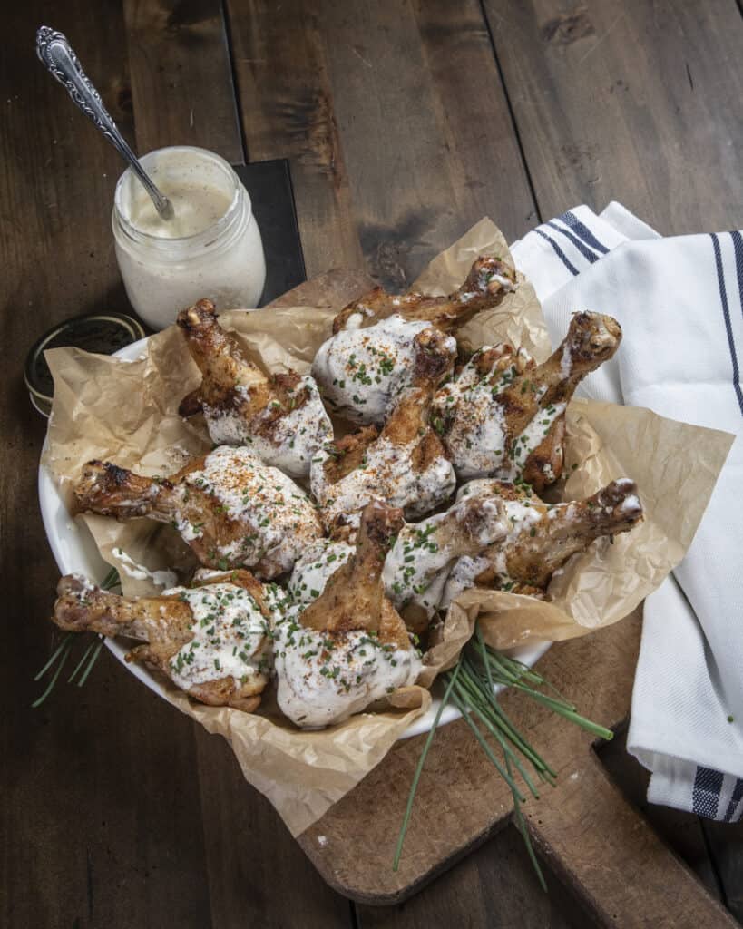Grilled chicken drumsticks with Alabama white sauce