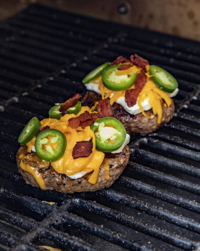 Jalapeno popper burgers on the grill