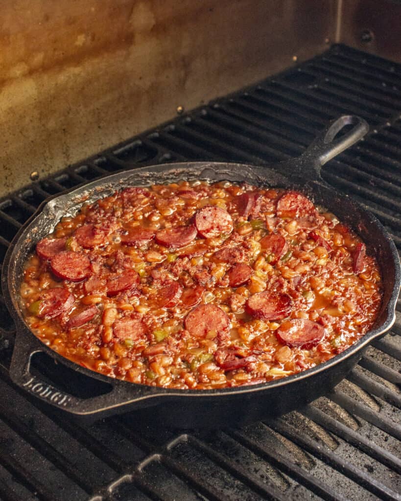 loaded baked beans in a cast iron pan