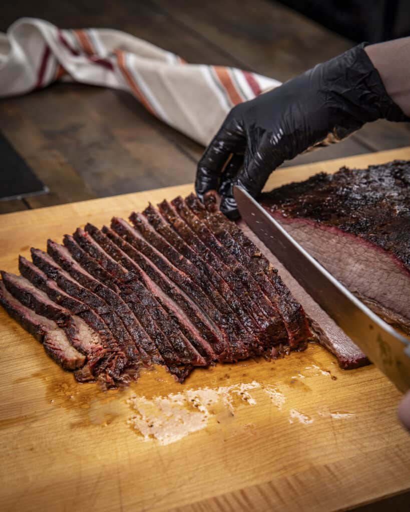 Slicing a 15 pound smoked brisket 