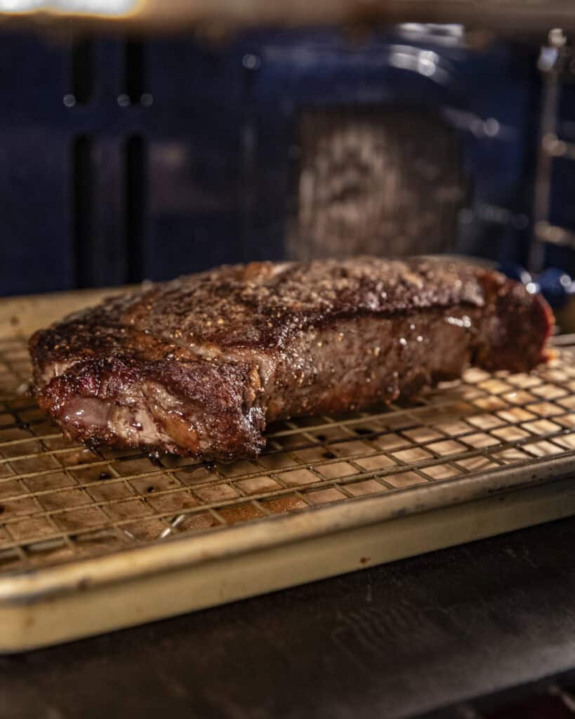 Thick cut steak in an oven